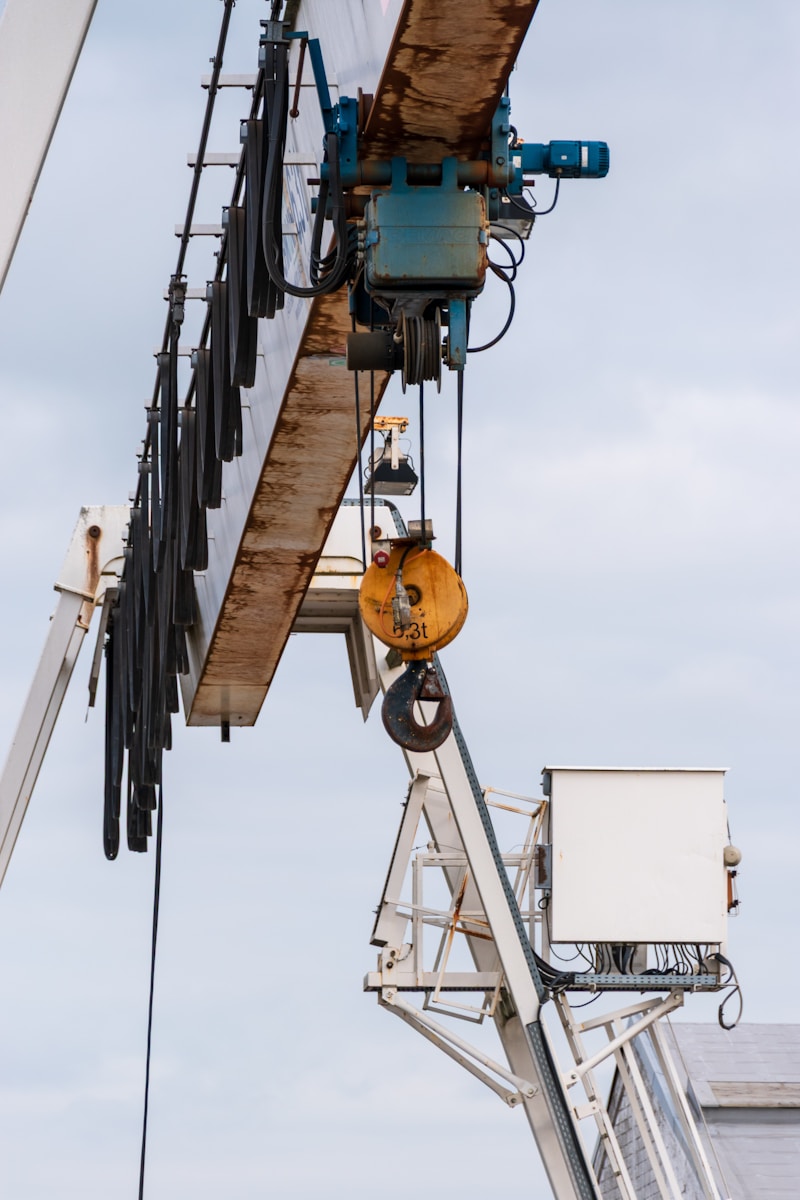 Industrial crane structure against a cloudy sky